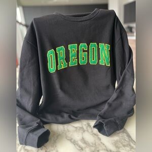 Black Sweatshirt with Green & Yellow 'OREGON' Appliqué. Unisex sweatshirt.